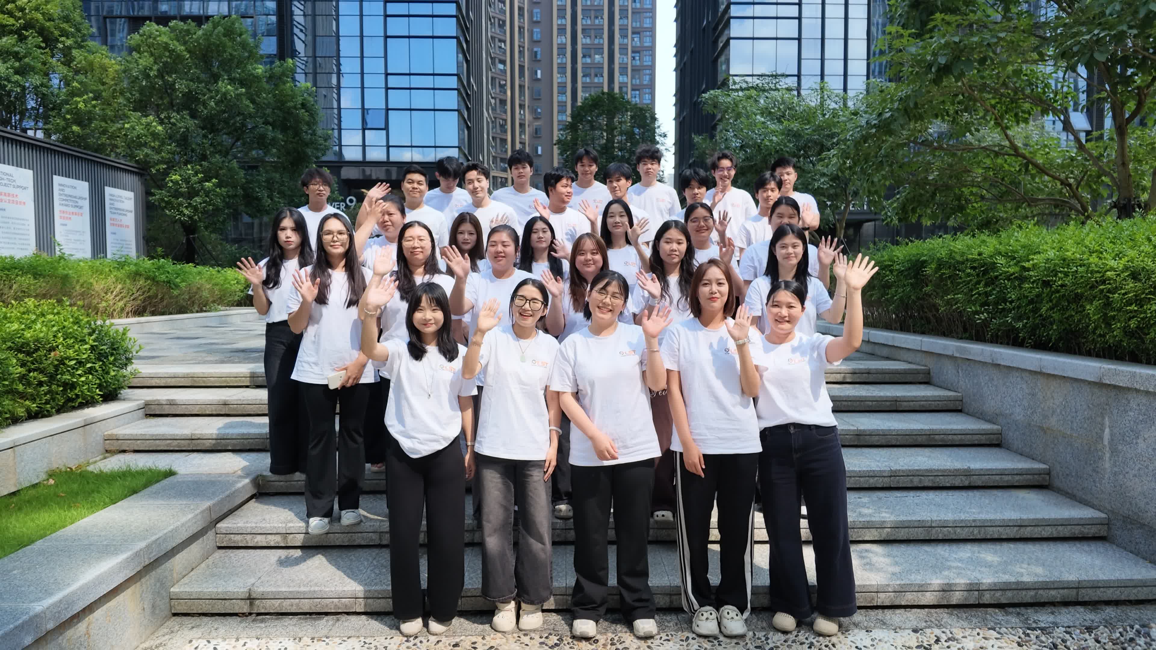LST team members gathered on the steps outside the office